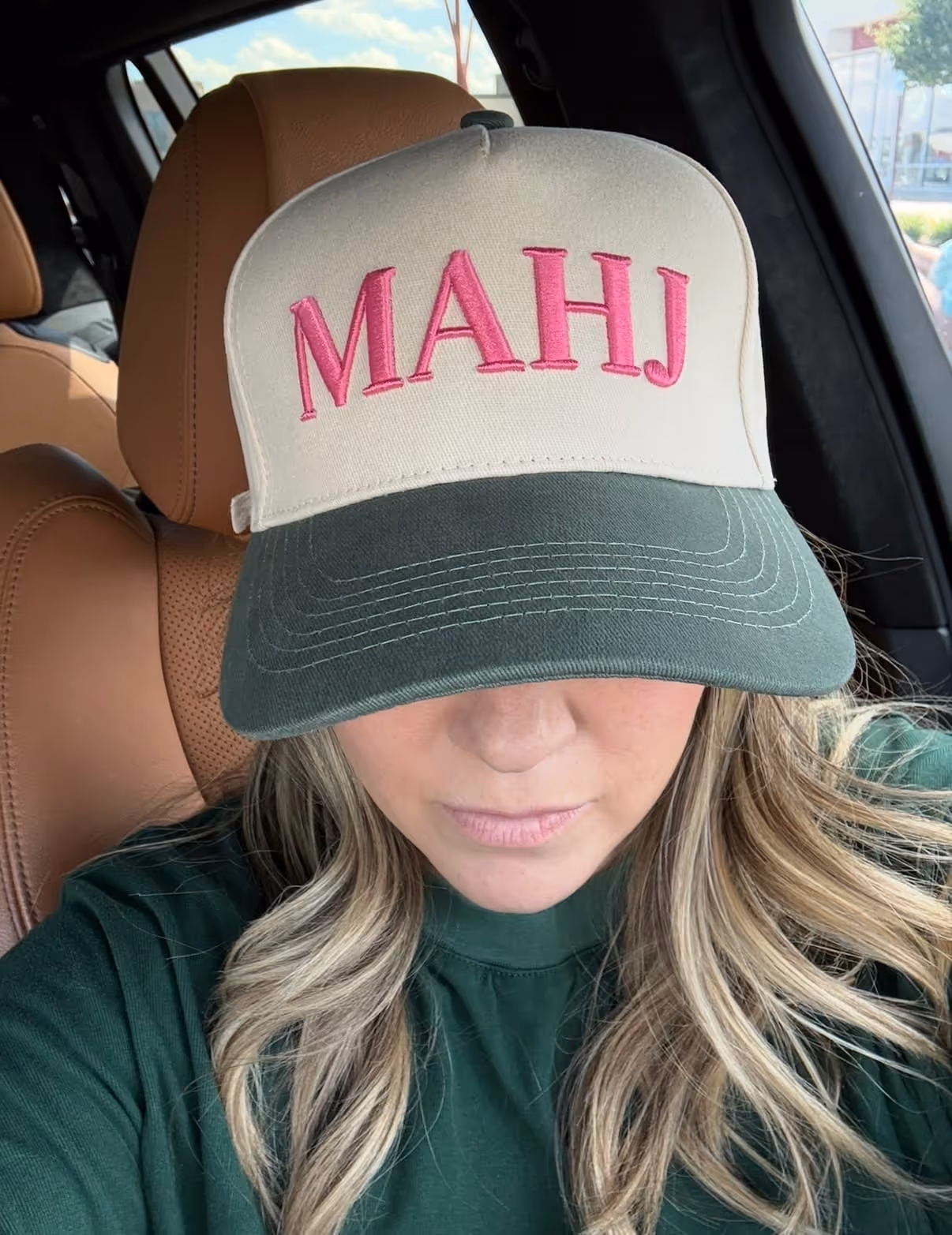 Courtney Colclough, founder of Mahjong Standard, wearing a Mahj cap