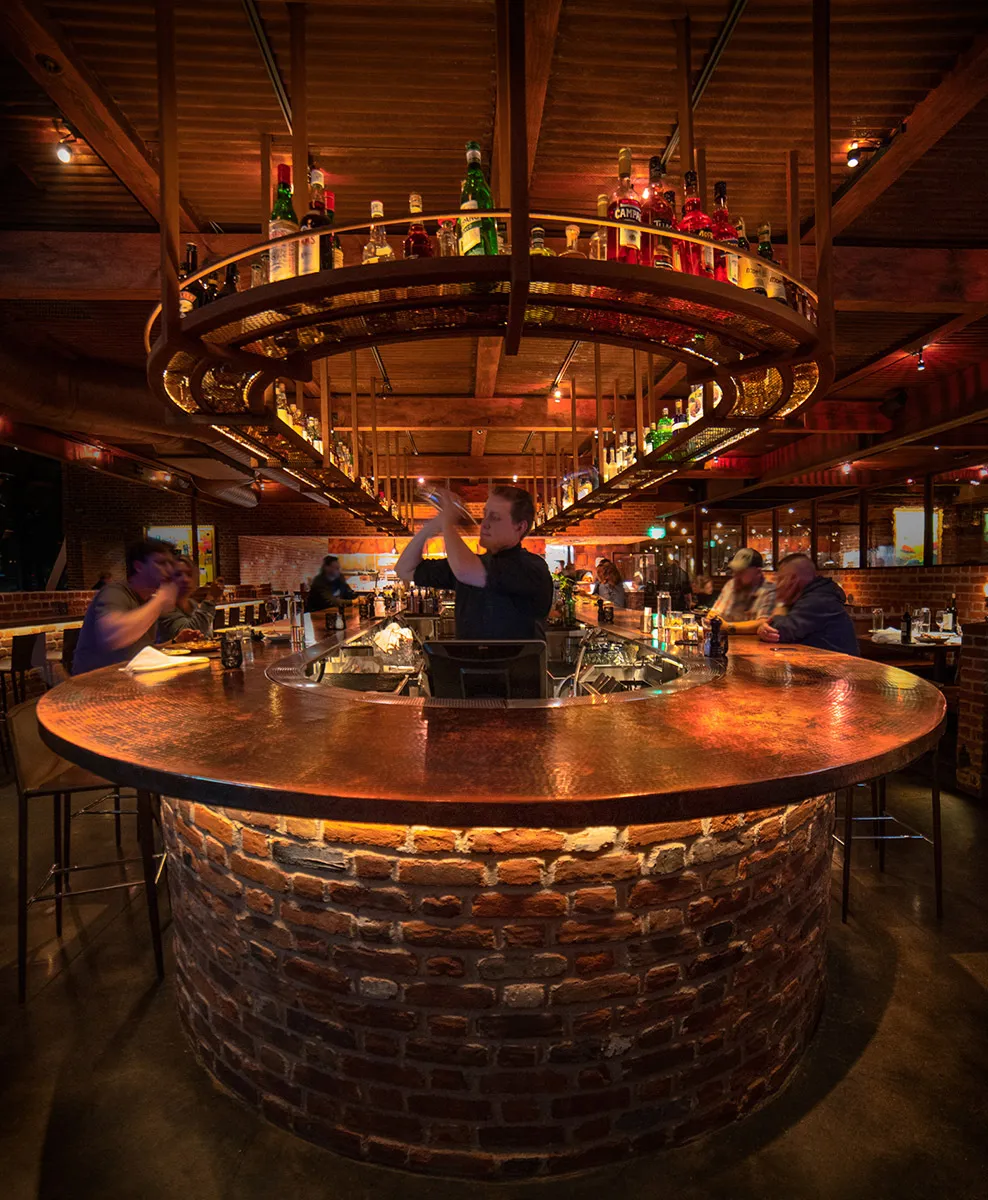 Inside Sierra Grill, Lone Tree, a cozy bar area with warm lighting and an inviting atmosphere