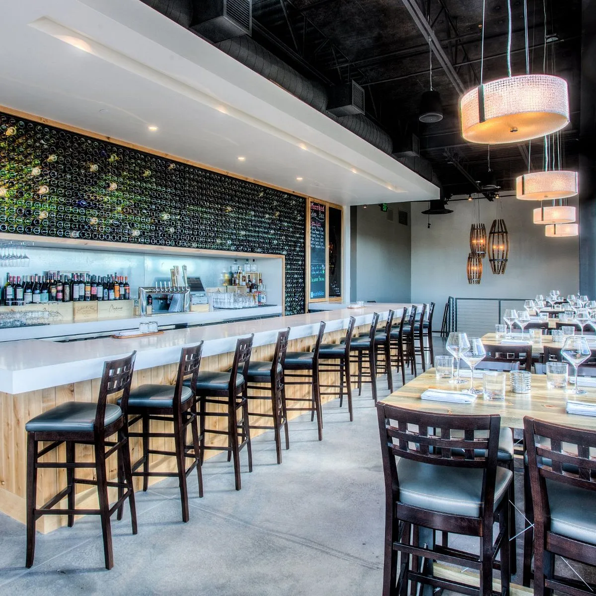 Inside Uncorked Wine Bar in Centennial, a cozy social space with warm lighting and wine-bar atmosphere